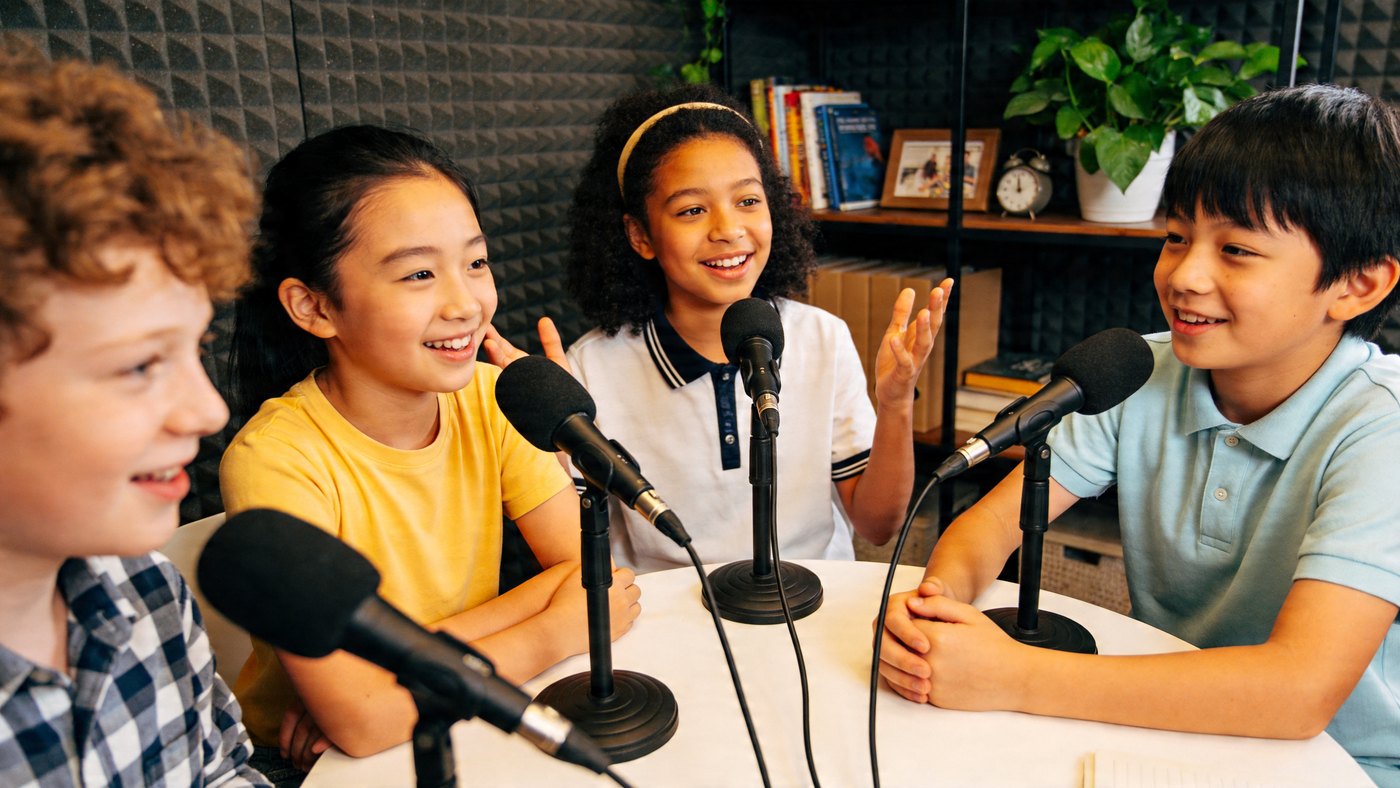 Children recording a podcast together at YoungInspirer